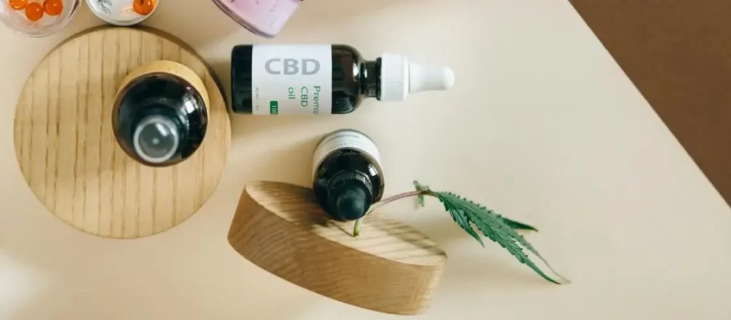 A first-time patient holding a plant-based therapy bottle